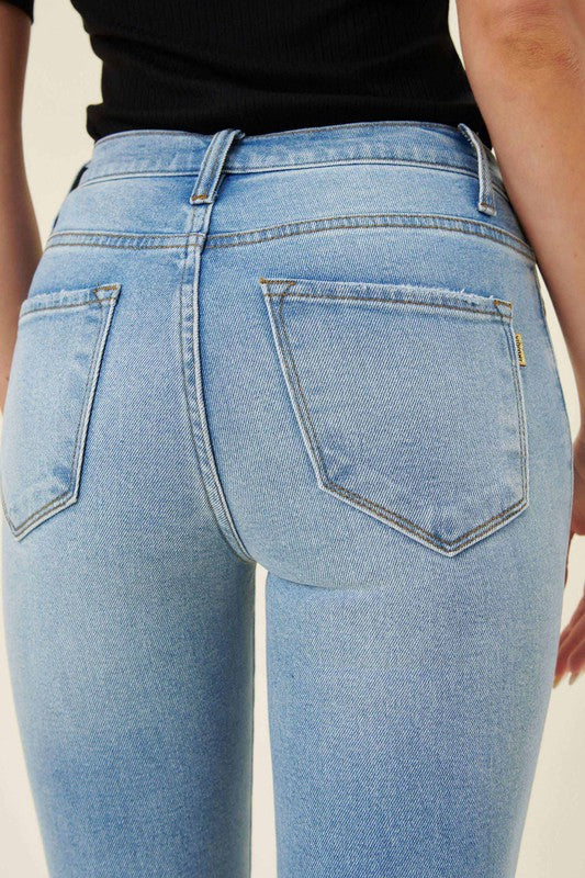 Vibrant M.i.U high waisted skinny jeans with distressed knee
