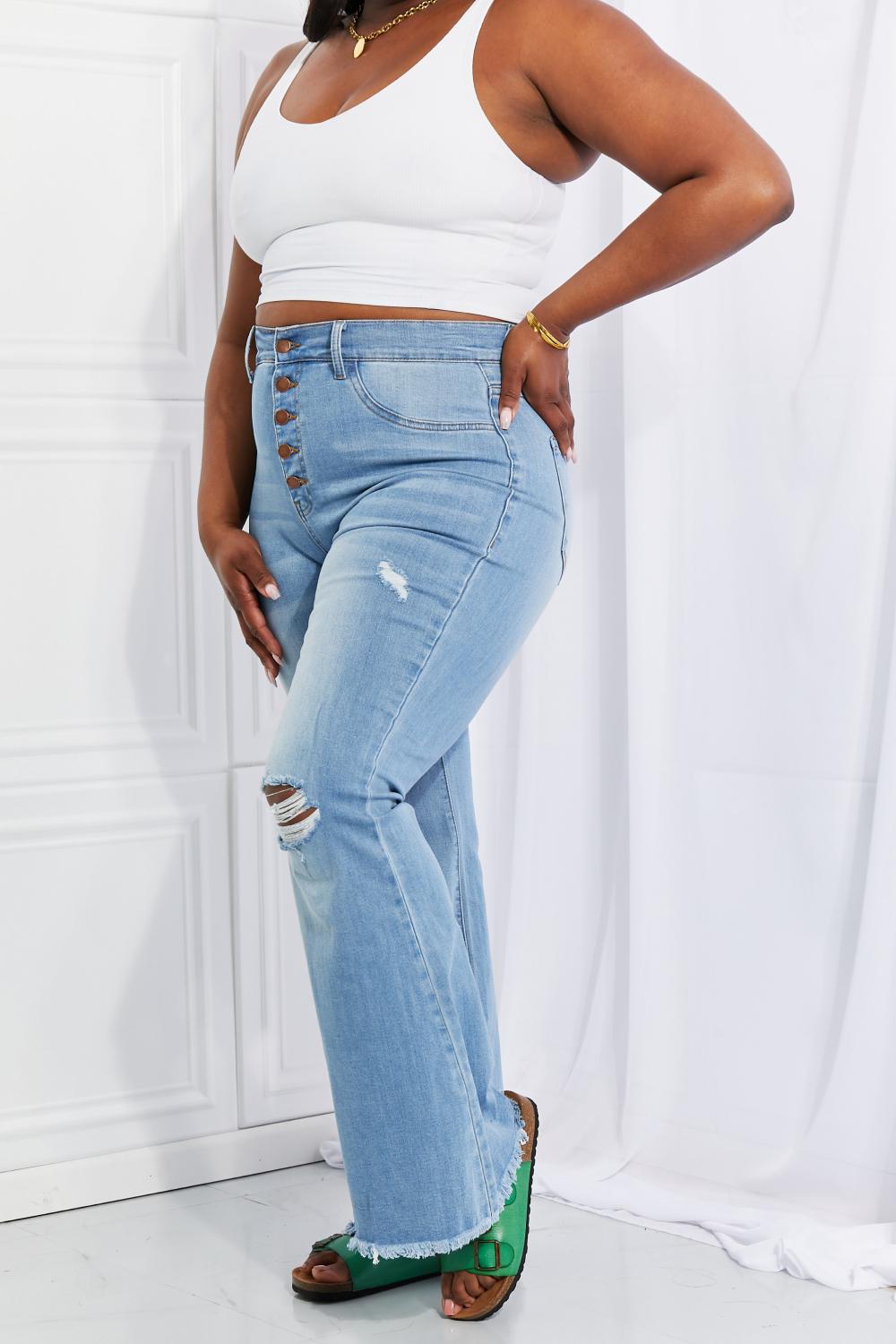 Vibrant M.i.U high-rise flared jeans for plus-size with subtle distressing.
