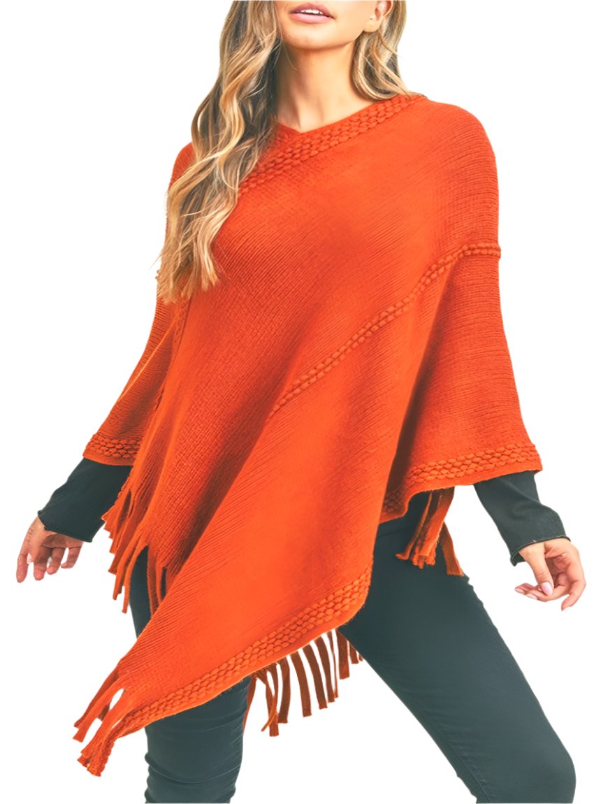 Bright orange knit poncho with fringe, perfect for making a bold fashion statement in cooler weather.