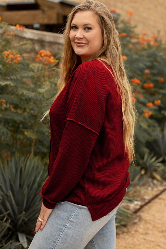 Burgundy plus-size waffle-knit top styled with light-wash jeans for a laid-back vibe