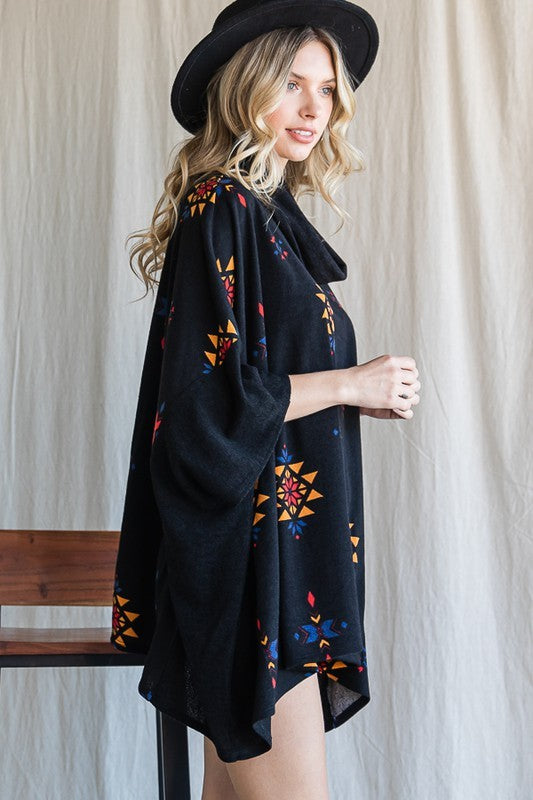 Oversized cowl neck poncho in a southwestern pattern for a boho chic look.