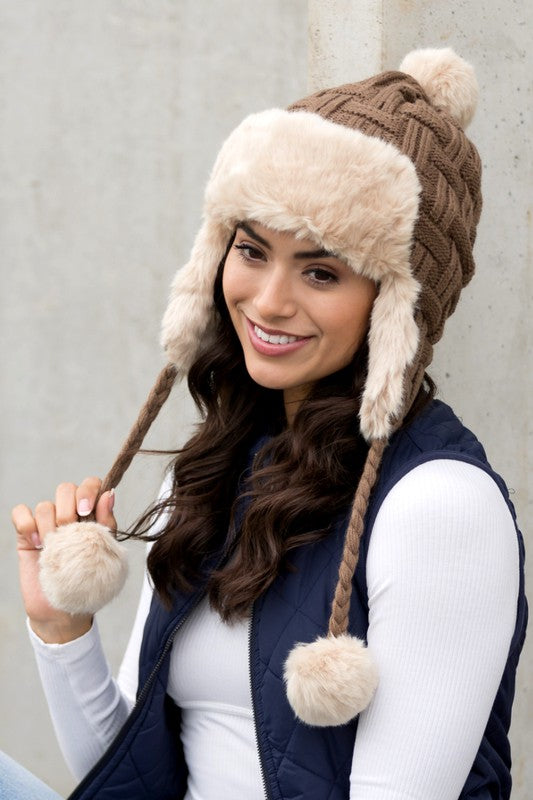 Warm trapper hat with classic cable weave design
