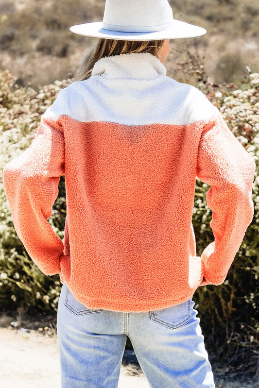 Warm and stylish coral sherpa pullover for cold weather
