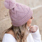 Stylish chunky knit pom beanie in mauve for cozy winter wear
