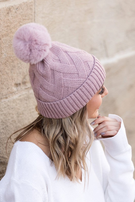 Stylish chunky knit pom beanie in mauve for cozy winter wear
