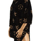 Black poncho with elegant floral design, fuzzy texture
