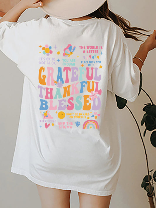 Back view of white "Be Kind to Your Mind" tee with large colorful graphic.