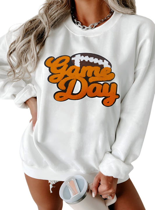 White sweatshirt with chenille "Game Day" text and football graphic.