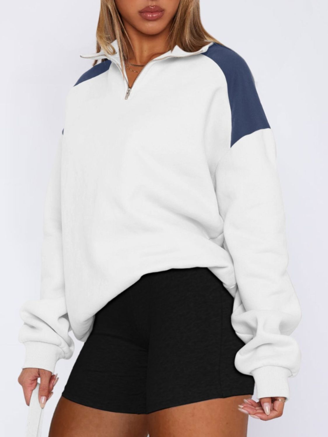 White color block half-zip sweatshirt, chic and versatile.
