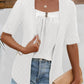 White faux layered top featuring an eyelet design and button accents