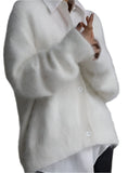 White oversized button-front cardigan with a fuzzy texture
