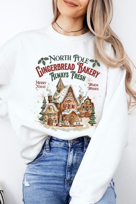 Classic white sweatshirt with festive gingerbread bakery design, ideal for holiday events.