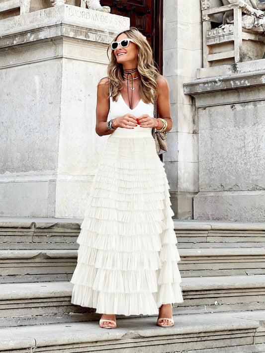 Front view of a white mesh cake multi-layer skirt with a cascading tiered design.
