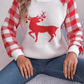 Front view of white reindeer knit sweater with red plaid sleeves, perfect for holiday gatherings and winter wear.