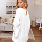 White satin lounge set featuring a welt pocket and short sleeves.
