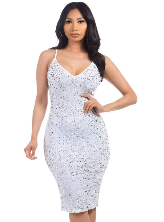 Model wearing a white sequin dress with spaghetti straps, front view.
