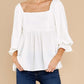 White square neck babydoll top with ruffled sleeves and a relaxed fit.
