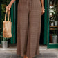 Lightweight brown pants with smocked waistband detail
