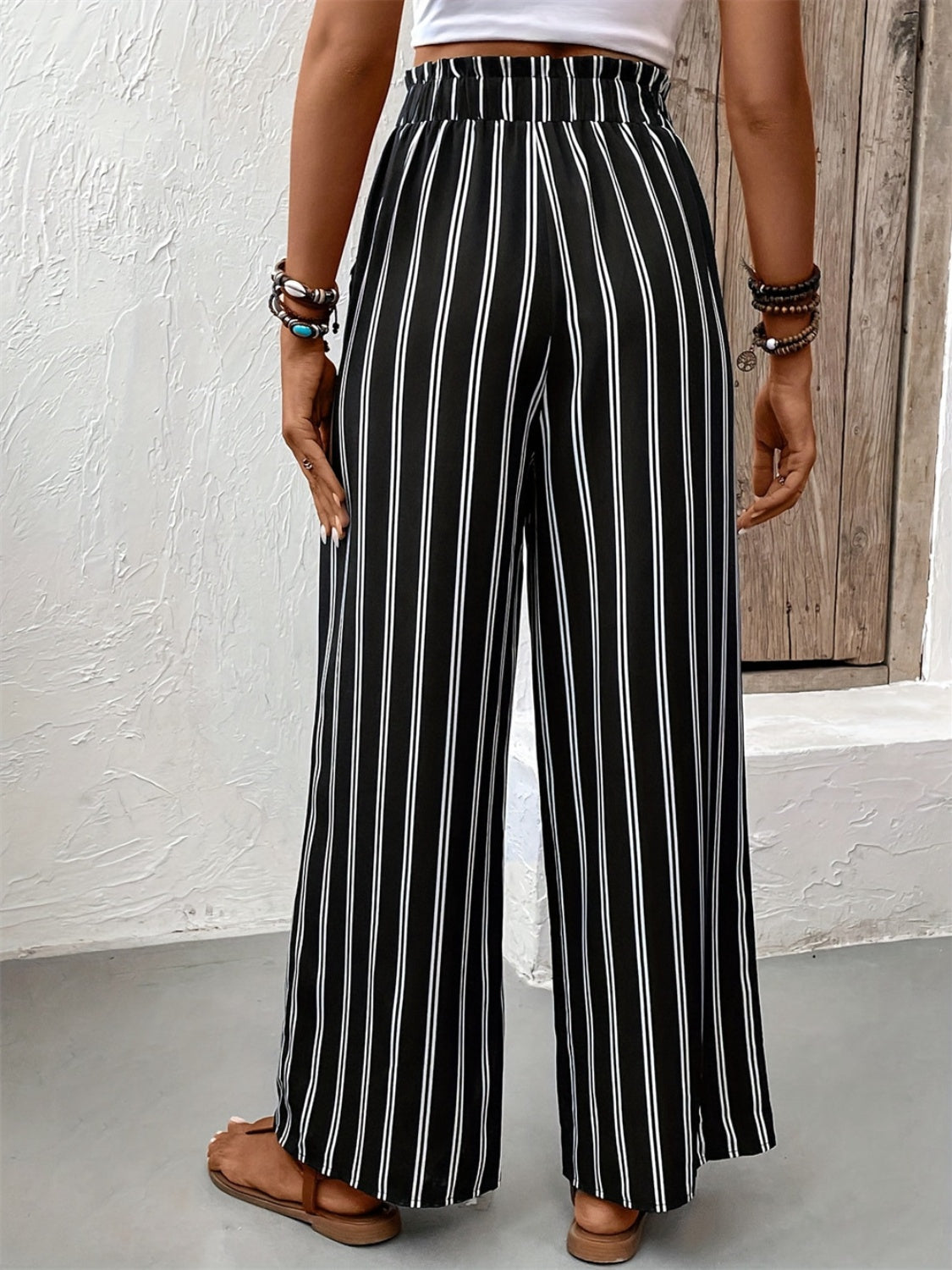 Women's high-waisted wide-leg pants with a tie belt