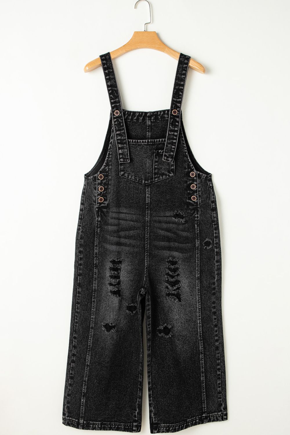 Comfortable women’s black denim overalls with a relaxed, roomy fit.
