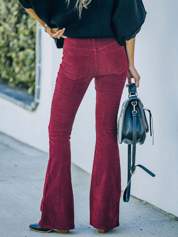 Back view of wine high-waist slim flared corduroy pants with elastic waist.
