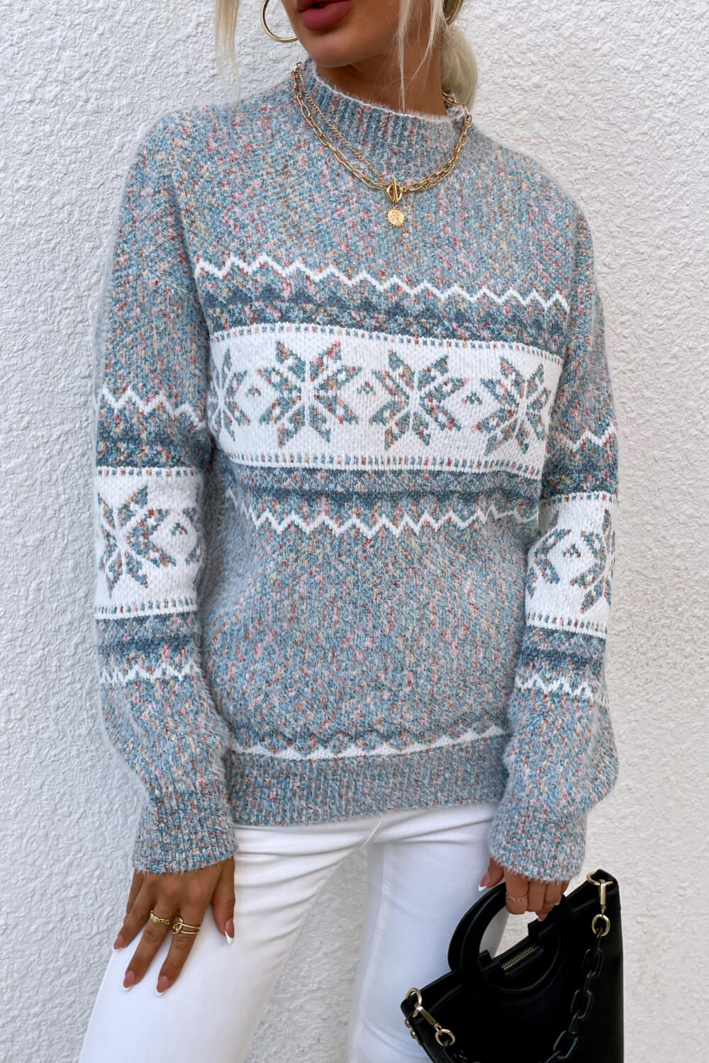 Winter-ready cloudy blue sweater featuring a snowflake pattern and soft knit material for comfort.

