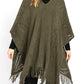 Olive paisley perforated knit poncho with fringe hem, front view.
