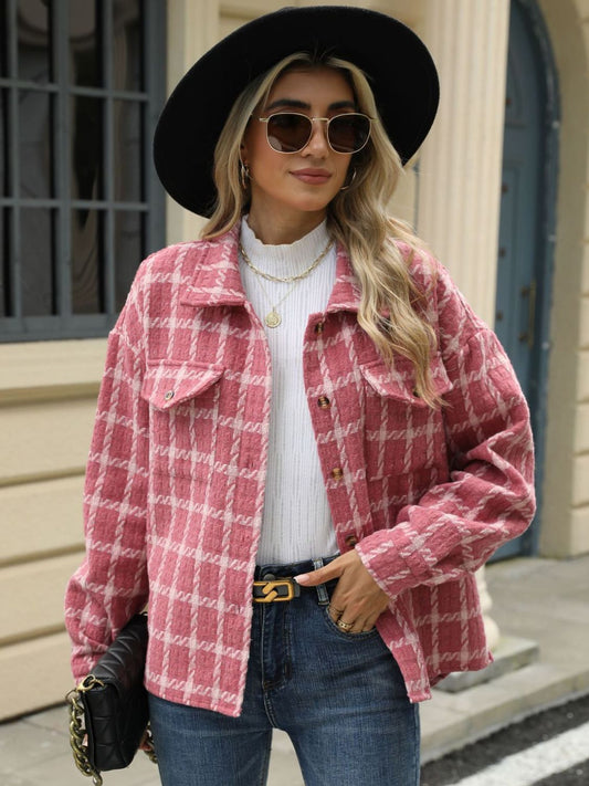 Women's oversized pink plaid shacket with button-down front.
