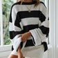 Classic black and white striped sweater for a versatile, everyday look.
