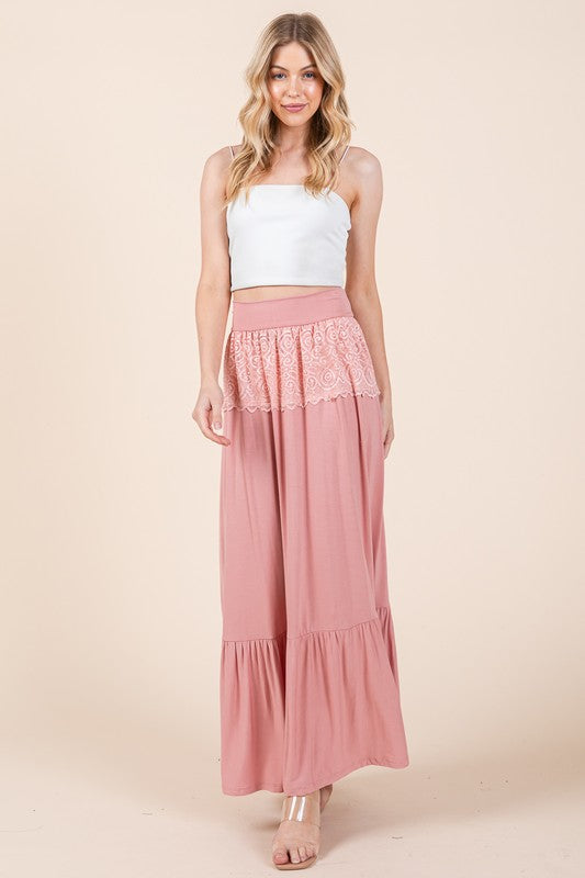 Comfortable ruffle maxi skirt with lace detail at the waist.
