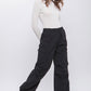 Women’s black cargo pants with a drawstring waist, perfect for casual wear.
