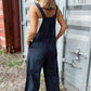 Classic plaid overalls with a relaxed wide-leg silhouette for casual wear.
