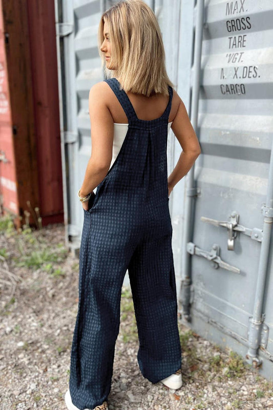 Classic plaid overalls with a relaxed wide-leg silhouette for casual wear.
