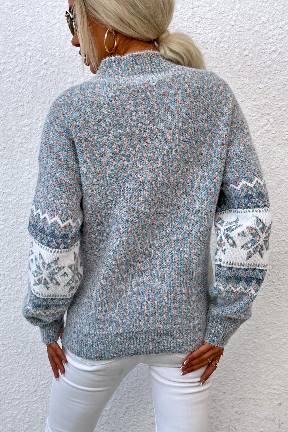 Women’s cloudy blue snowflake knit sweater, perfect for festive gatherings or casual winter wear.

