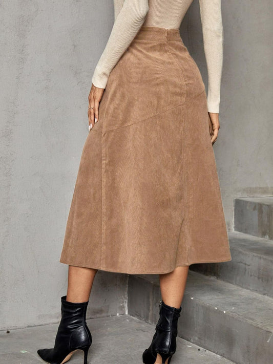 Fall corduroy skirt in warm camel, perfect for autumn wear.
