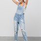 Women’s relaxed-fit ripped denim light wash overalls 
