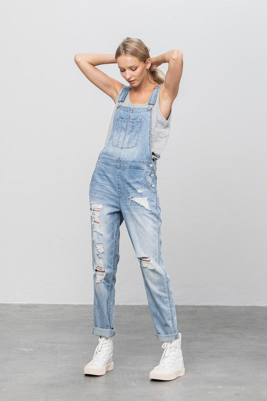 Women’s relaxed-fit ripped denim light wash overalls 
