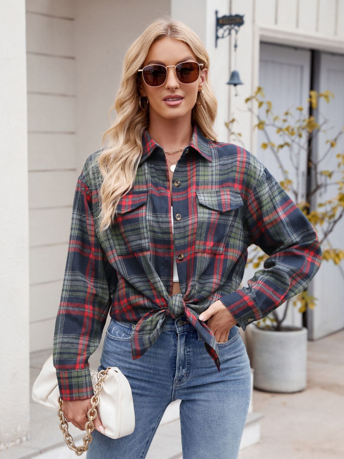 Classic dark navy plaid shirt layered over a fitted white tank top.
