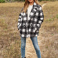 Chic boucle plaid coat for women, featuring side pockets and a lapel neck.
