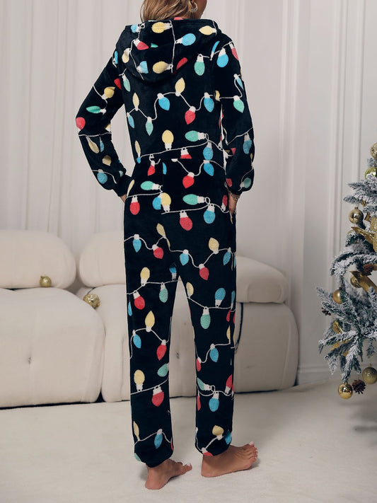 Festive lounge jumpsuit featuring holiday lights on soft fleece fabric
