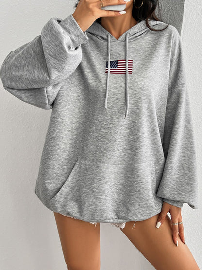 Soft gray hoodie featuring a small American flag on the chest.
