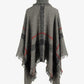 Timeless plaid poncho in gray with fringe detailing.
