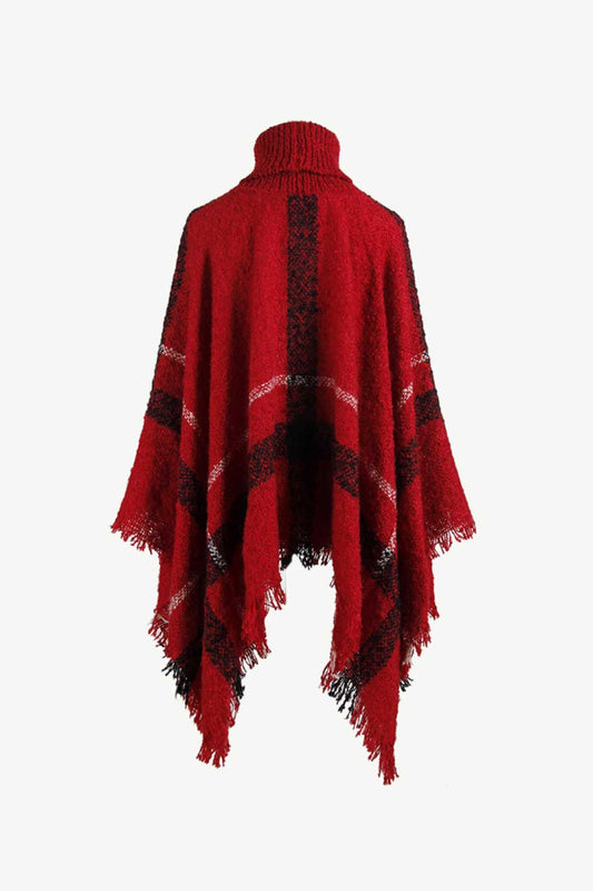 Red plaid poncho with turtleneck, perfect for fall layering.
