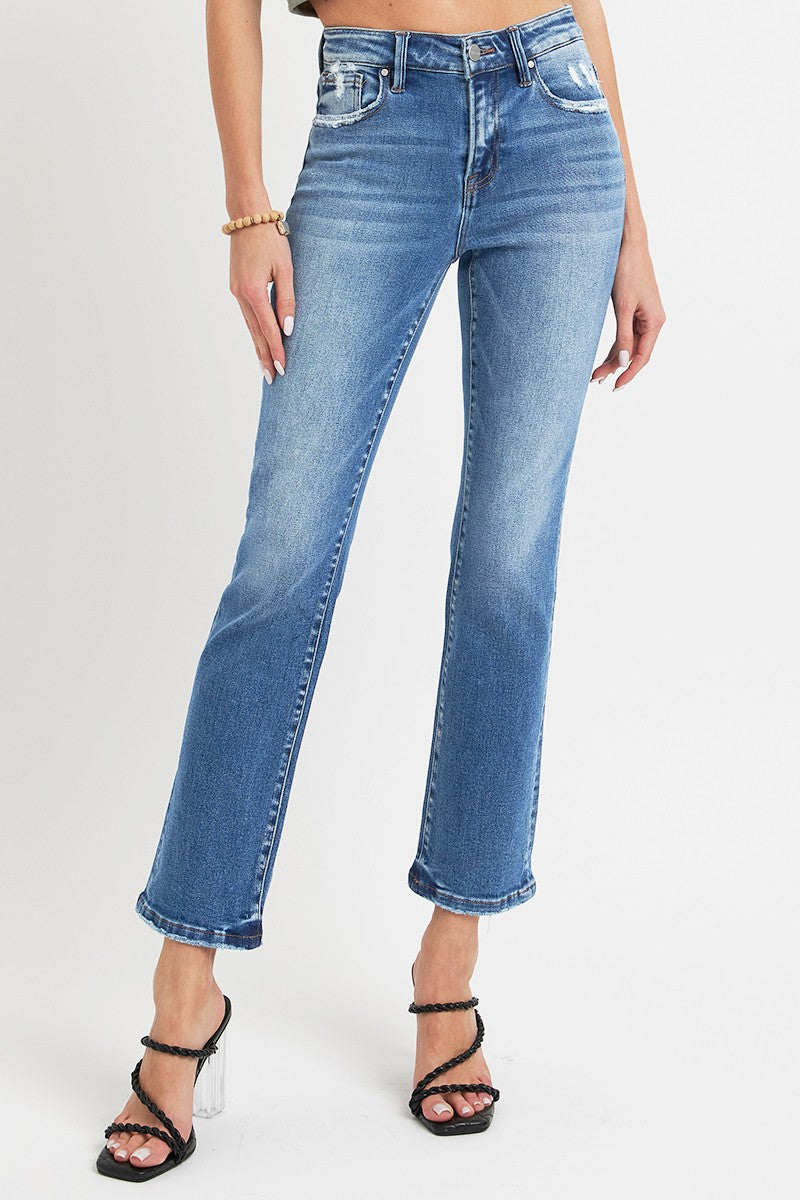 RISEN jeans styled casually with sleek ankle-length detail.
