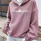 Soft pink fleece pullover with mountain graphic and half-zip front.
