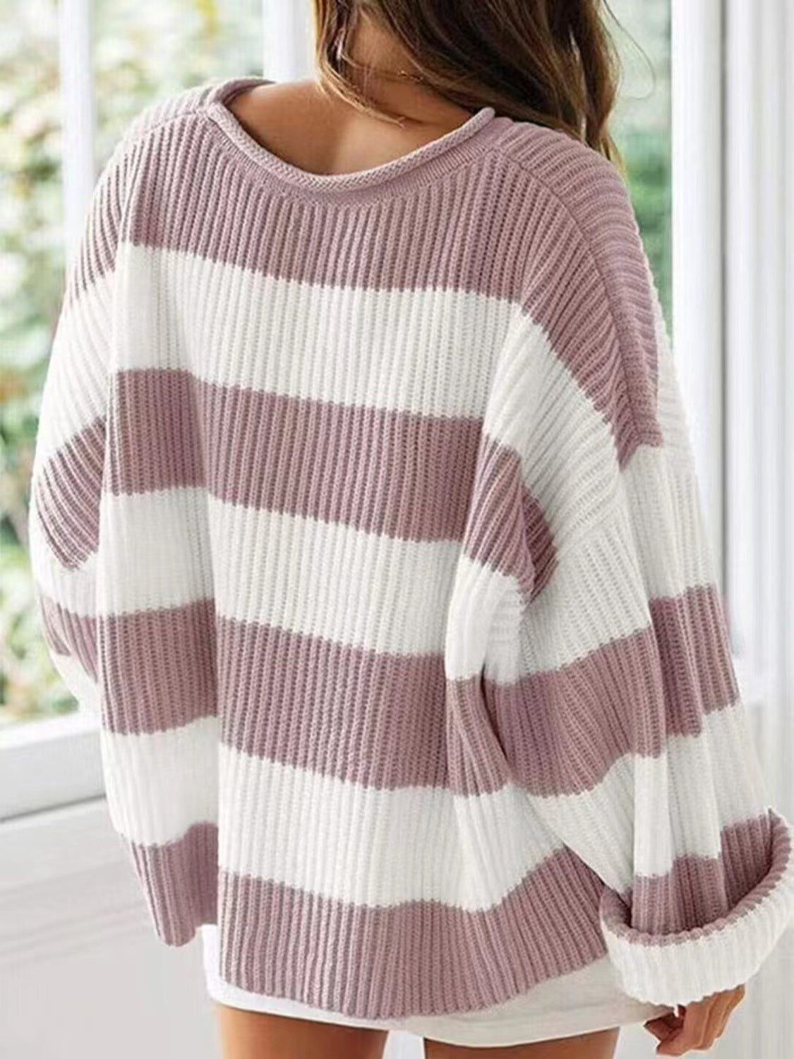 Relaxed-fit pink and white striped sweater for everyday comfort.
