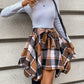 Plaid asymmetrical skirt in caramel, ideal for autumn outfits.
