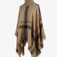 Cozy caramel plaid poncho with fringe and turtleneck design.
