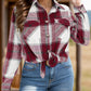 Burgundy plaid shirt featuring a relaxed fit and button closures.
