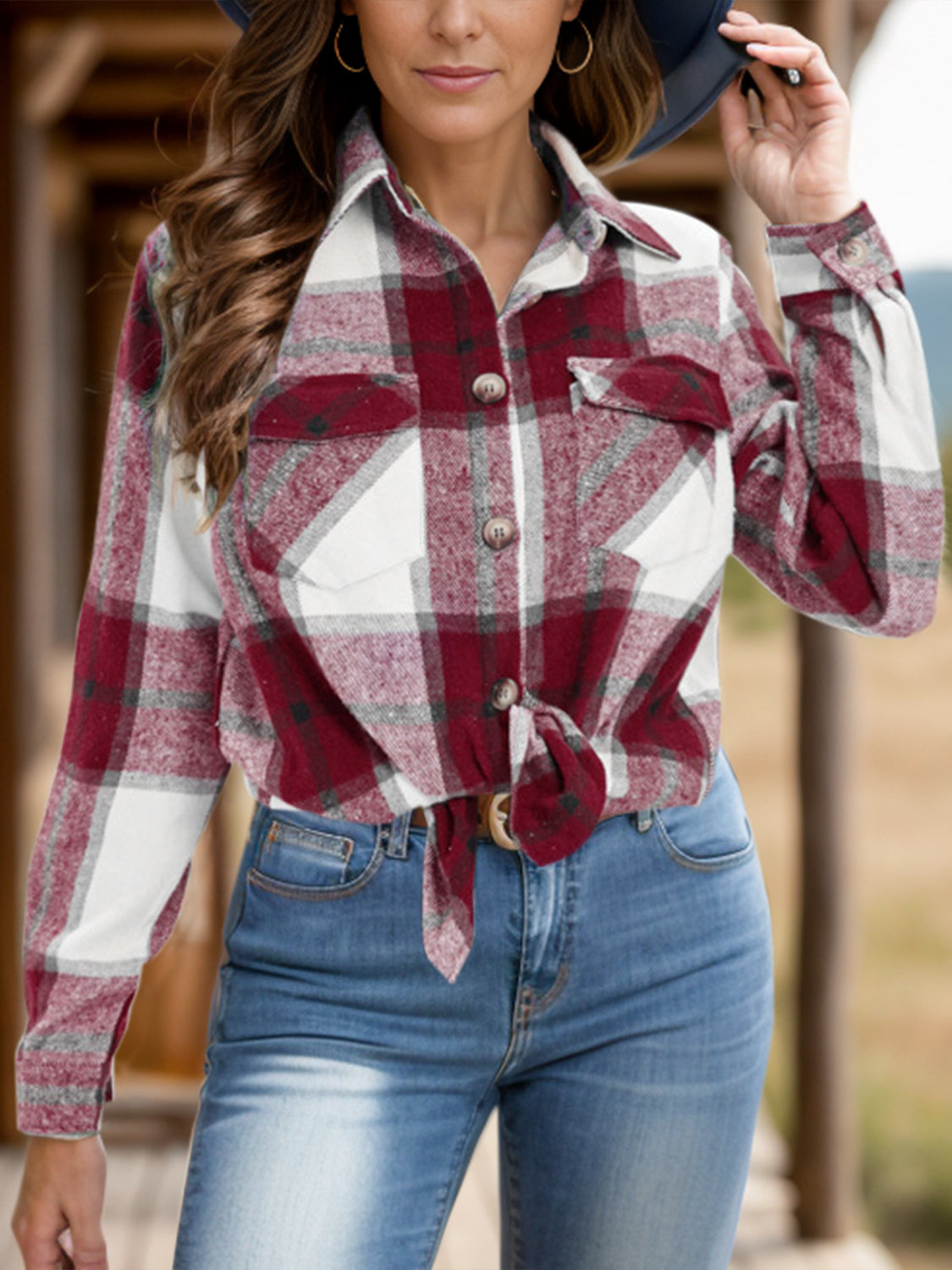 Burgundy plaid shirt featuring a relaxed fit and button closures.
